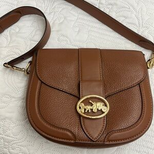 - Coach crossbody handbag. Earn a bit but still like new.